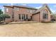 The rear exterior displays a brick facade and a patio with outdoor seating at 6040 Boulder Bluff Dr, Cumming, GA 30040