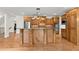 Gourmet kitchen featuring a large island, custom wood cabinetry, and stainless steel appliances at 6040 Boulder Bluff Dr, Cumming, GA 30040