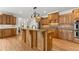 Kitchen featuring granite countertops, custom wood cabinets, and stainless steel appliances at 6040 Boulder Bluff Dr, Cumming, GA 30040