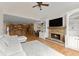 Open floor plan: Living room and dining area connected with a stone fireplace feature at 6040 Boulder Bluff Dr, Cumming, GA 30040