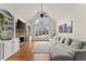 Spacious living room features a stone fireplace, built-in shelves, and large windows at 6040 Boulder Bluff Dr, Cumming, GA 30040