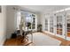 Bright and airy office featuring hardwood floors, a large window, and stylish French doors at 6040 Boulder Bluff Dr, Cumming, GA 30040