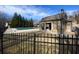Fenced pool area with an outdoor kitchen in a home backyard at 6040 Boulder Bluff Dr, Cumming, GA 30040