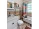 Bathroom featuring a vintage clawfoot tub, black and white tile floor, and ample storage at 746 United Se Ave, Atlanta, GA 30312
