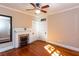 This bedroom boasts a vintage fireplace, hardwood floors, and natural light at 746 United Se Ave, Atlanta, GA 30312