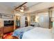 Bedroom with four-poster bed, TV, and charming decor at 746 United Se Ave, Atlanta, GA 30312