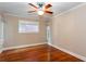 This bedroom features hardwood floors, crown moulding, and natural light from two windows at 746 United Se Ave, Atlanta, GA 30312