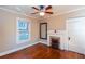 This bedroom boasts a vintage fireplace, hardwood floors, and natural light at 746 United Se Ave, Atlanta, GA 30312