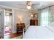 Bedroom featuring a ceiling fan, hardwood floors, and adjacent sunroom at 746 United Se Ave, Atlanta, GA 30312