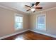 This bedroom features hardwood floors, crown moulding, and natural light from two windows at 746 United Se Ave, Atlanta, GA 30312