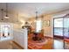 Cozy dining room with hardwood floors, chandelier, and access to an outdoor porch area at 746 United Se Ave, Atlanta, GA 30312