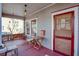 Charming front porch featuring a porch swing, seating, and a vibrant red door at 746 United Se Ave, Atlanta, GA 30312