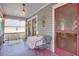 Charming porch featuring cozy seating area and a decorative light fixture for relaxation at 746 United Se Ave, Atlanta, GA 30312