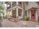 Charming front porch with string lights, brick columns, and a brick walkway leading to the entrance at 746 United Se Ave, Atlanta, GA 30312