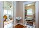 Hallway between sunroom with hardwood floors and bathroom with vintage tub at 746 United Se Ave, Atlanta, GA 30312