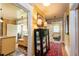 Hallway featuring hardwood floors, decorative rugs, and access to kitchen and bathroom with a clawfoot tub at 746 United Se Ave, Atlanta, GA 30312
