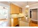 Kitchen area with a center island, wood cabinets, a dishwasher, and a sink by the window at 746 United Se Ave, Atlanta, GA 30312