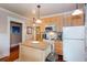 Kitchen featuring an island with a white countertop, stainless appliances, and plenty of cabinetry for storage at 746 United Se Ave, Atlanta, GA 30312
