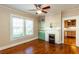 Bright living room featuring a fireplace, custom built-ins, and hardwood floors at 746 United Se Ave, Atlanta, GA 30312