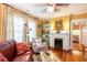 Bright living room showcasing hardwood floors, a fireplace, and built-in shelving, perfect for relaxing or entertaining at 746 United Se Ave, Atlanta, GA 30312
