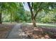 Scenic walking path through a lush, green park with mature trees and picnic area at 746 United Se Ave, Atlanta, GA 30312