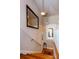 Upstairs hallway featuring wooden staircase, a unique colored glass window and decorative mirror at 746 United Se Ave, Atlanta, GA 30312