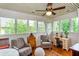 Bright sunroom with white walls and ceilings, multiple windows offering lots of natural light, plus comfortable seating at 746 United Se Ave, Atlanta, GA 30312