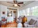 Sunroom with hardwood floors, ceiling fan, many windows, and comfortable seating at 746 United Se Ave, Atlanta, GA 30312