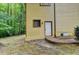 Exterior detail of the home, showing the back door and the surrounding wooded area at 1922 Marshes Glenn Dr, Norcross, GA 30071