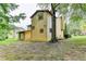 This backyard has a sprawling lawn and mature trees that add to the charm of this home at 1922 Marshes Glenn Dr, Norcross, GA 30071