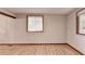 Bedroom with wood floor and window with natural light at 1922 Marshes Glenn Dr, Norcross, GA 30071