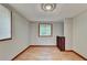 Bedroom with neutral walls, wood floor and window with view at 1922 Marshes Glenn Dr, Norcross, GA 30071