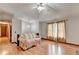 Open-concept living room featuring wood-look flooring, neutral walls and an abundance of natural light at 1922 Marshes Glenn Dr, Norcross, GA 30071