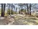 A mostly cleared lot with mature trees in the backyard, perfect for building or recreation at 3359 Mansfield Ln, Snellville, GA 30039
