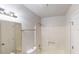 Bright bathroom featuring a shower and vanity mirror at 3359 Mansfield Ln, Snellville, GA 30039
