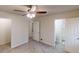 Bedroom featuring a ceiling fan, two windows, and neutral carpet at 3359 Mansfield Ln, Snellville, GA 30039