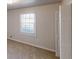 Bedroom with window, neutral color scheme, and carpet at 3359 Mansfield Ln, Snellville, GA 30039