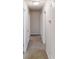 Well-lit hallway with neutral carpeting and fresh white doors at 3359 Mansfield Ln, Snellville, GA 30039