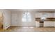 Eat-in kitchen with white cabinets, stainless appliances, and large window at 3359 Mansfield Ln, Snellville, GA 30039
