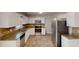 Modern kitchen with stainless steel appliances, granite counters and white cabinetry at 3359 Mansfield Ln, Snellville, GA 30039