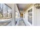 Covered porch with white pillars and railing, offering a cozy outdoor space at 3359 Mansfield Ln, Snellville, GA 30039