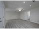 Spacious basement featuring laminate floors, drop ceiling, recessed lighting, and white doors at 6334 Milo Dr, Austell, GA 30168