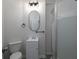 Bathroom with a shower, toilet, mirror and light fixture at 6334 Milo Dr, Austell, GA 30168