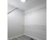 Walk-in closet featuring wire shelving and light gray wood floors throughout the space at 6334 Milo Dr, Austell, GA 30168