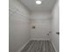 Walk in closet with vinyl floors, hanging shelves and drywall at 6334 Milo Dr, Austell, GA 30168