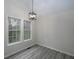 Bright dining area with vaulted ceilings, modern light fixture, and large windows at 6334 Milo Dr, Austell, GA 30168