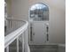 Close up of front door and large arched window, showcasing the home's bright and welcoming foyer at 6334 Milo Dr, Austell, GA 30168