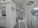 Bright entryway featuring stairs, a high ceiling, and view into the connected dining space at 6334 Milo Dr, Austell, GA 30168
