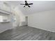 Spacious living room with bar seating and a view of the stairs, offering an open layout for modern living at 6334 Milo Dr, Austell, GA 30168