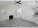 Open living space featuring a fireplace, vaulted ceilings, and bar seating into the connected kitchen area at 6334 Milo Dr, Austell, GA 30168
